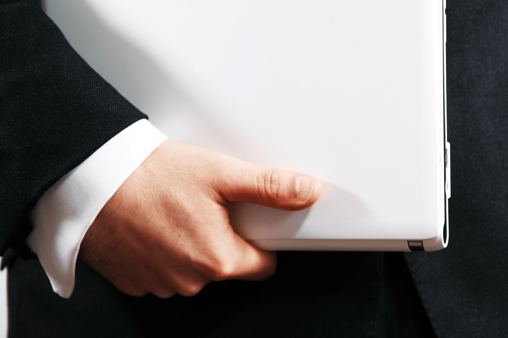 Salesperson carrying a business laptop